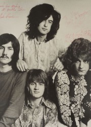 signed photo inscribed by Jimmy Page, Robert Plant, and John Bonham of Led Zeppelin