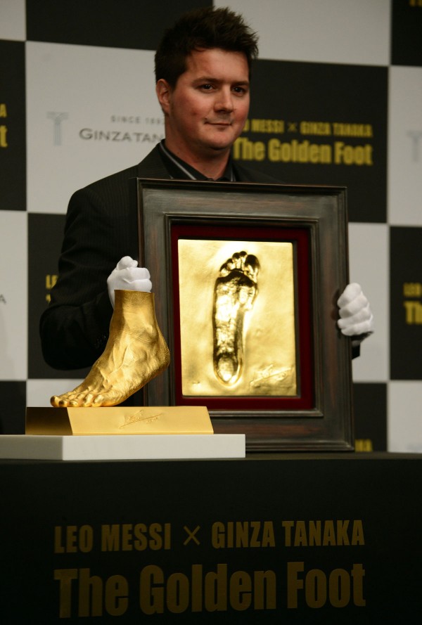 Rodrigo Messi, brother of football star Lionel Messi of Argentina, with Messis Left Foot Gold Sculpture 