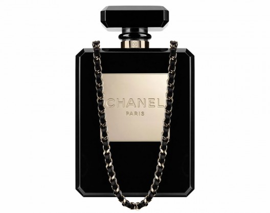 Chanels reinterpretation of its classic No.5 perfume bottle as a clear, plexiglass clutch holds all the promise of a seasonal hit