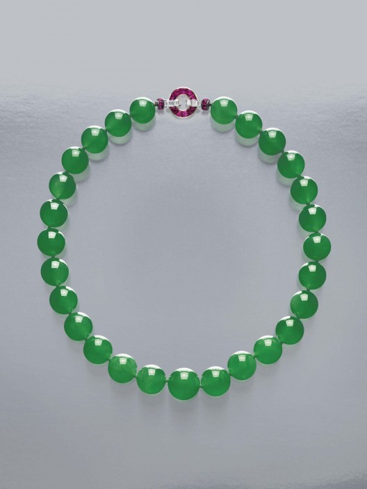 The Hutton-Mdivani Necklace, comprised of 27 enormous Qing jadeite beads with an Art Deco ruby and diamond clasp by Cartier