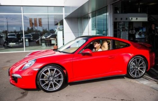 twenty three year-old player is also richer for the new red Porsche 911 Carrera 4